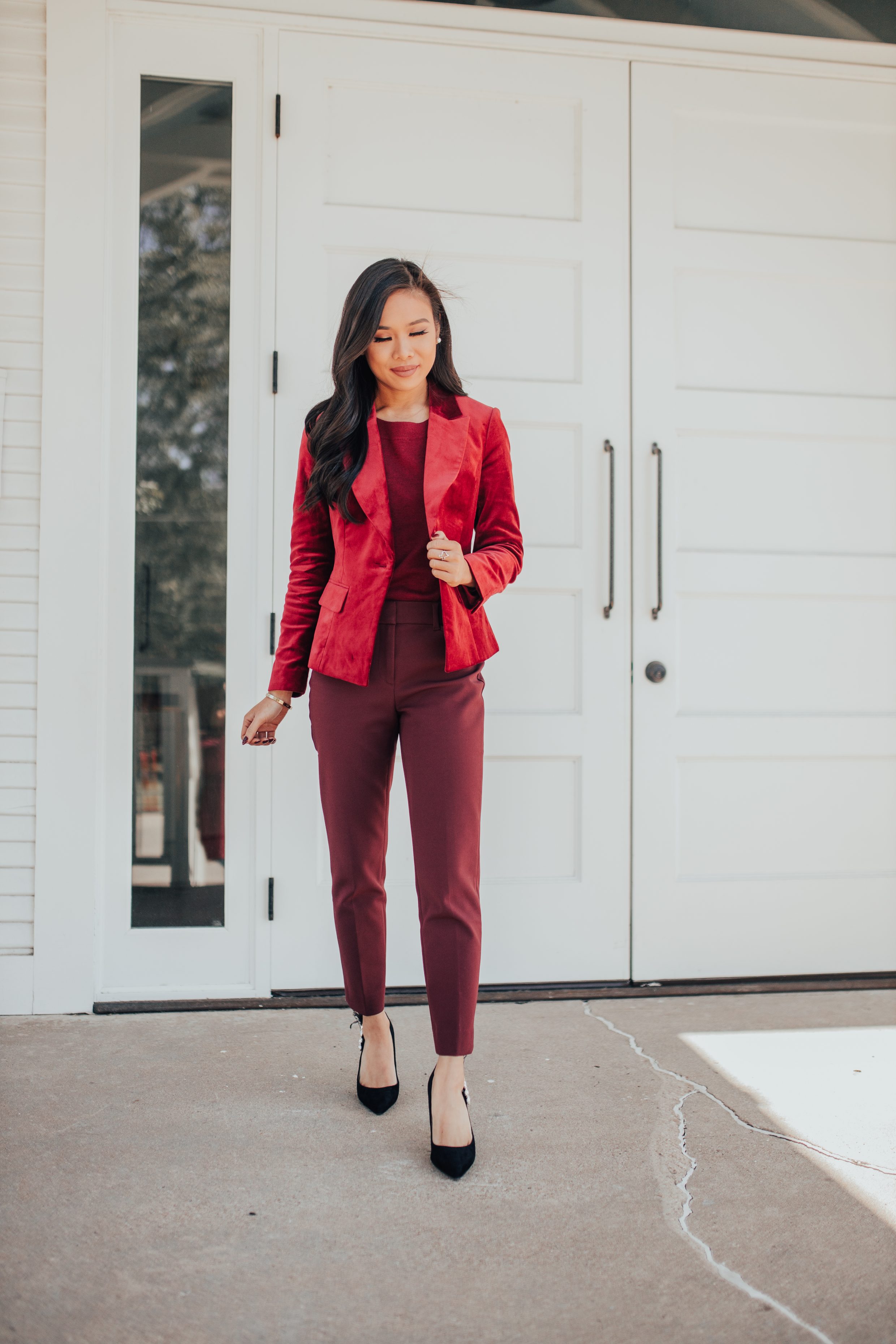 Holiday workwear style with a velvet blazer, cashmere sweater and dark red pants