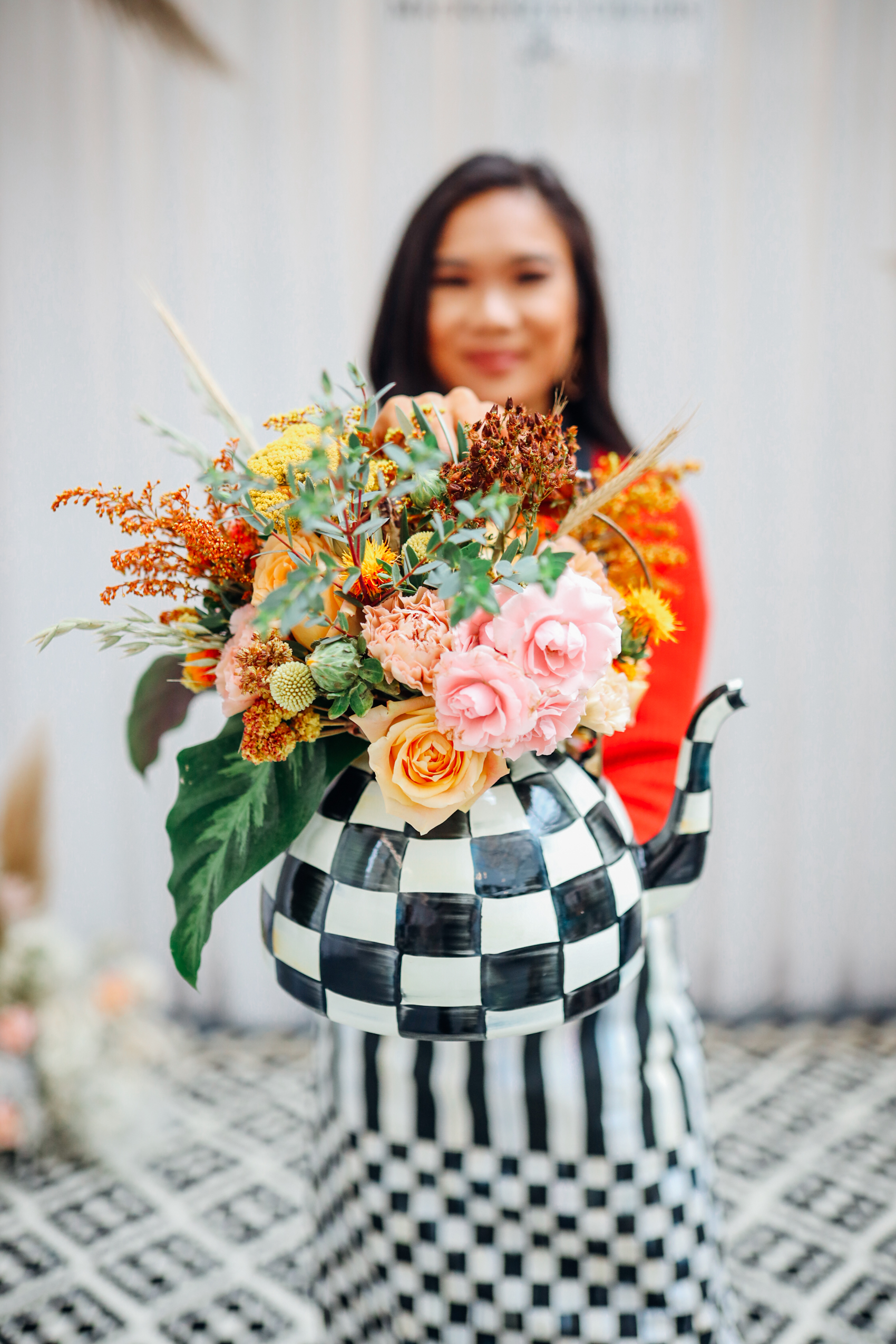 Flower arrangement in MacKenzie-Childs kettle by blogger Hoang-Kim