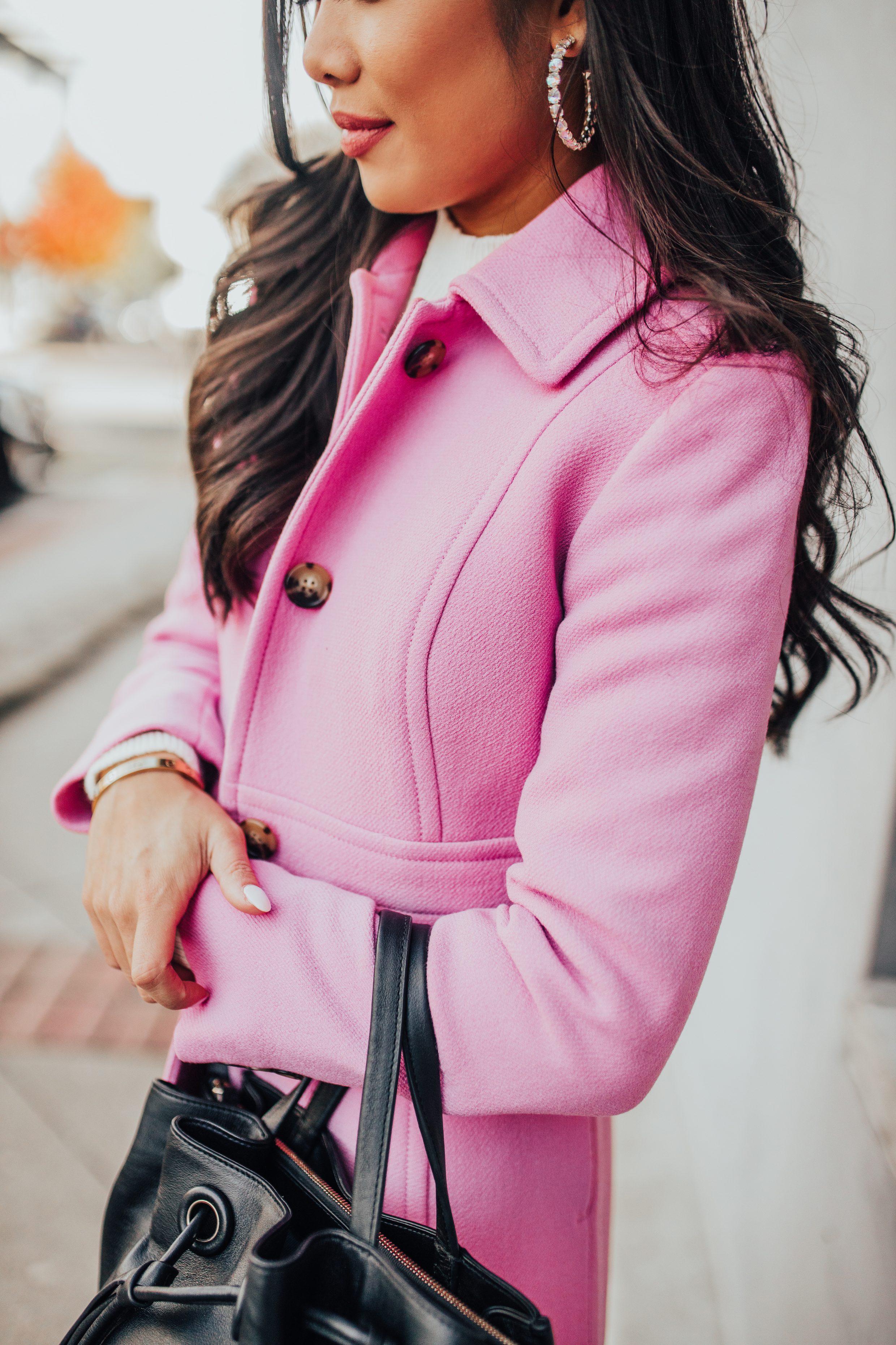 Pink winter coat outfit with Kendra Scott jolie earrings and a bucket bag