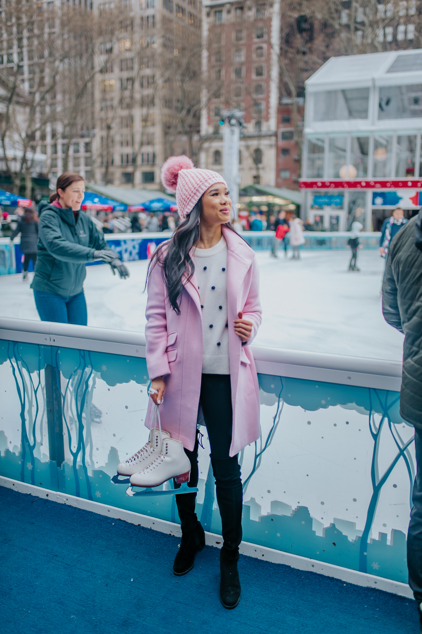Pink cocoon coat at Bryant Park ice rink in New York City