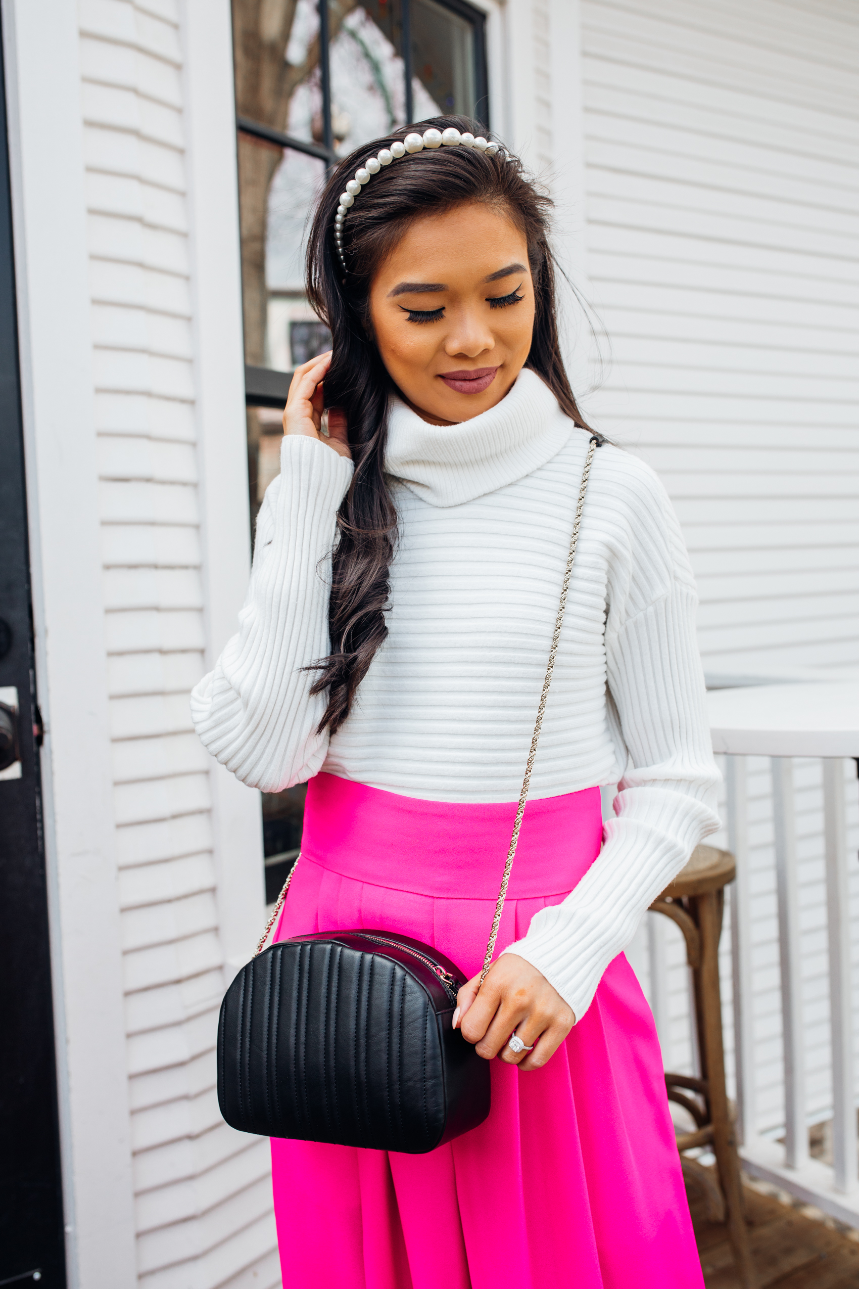 White turtleneck sweater outfit with pink pants and a pearl headband