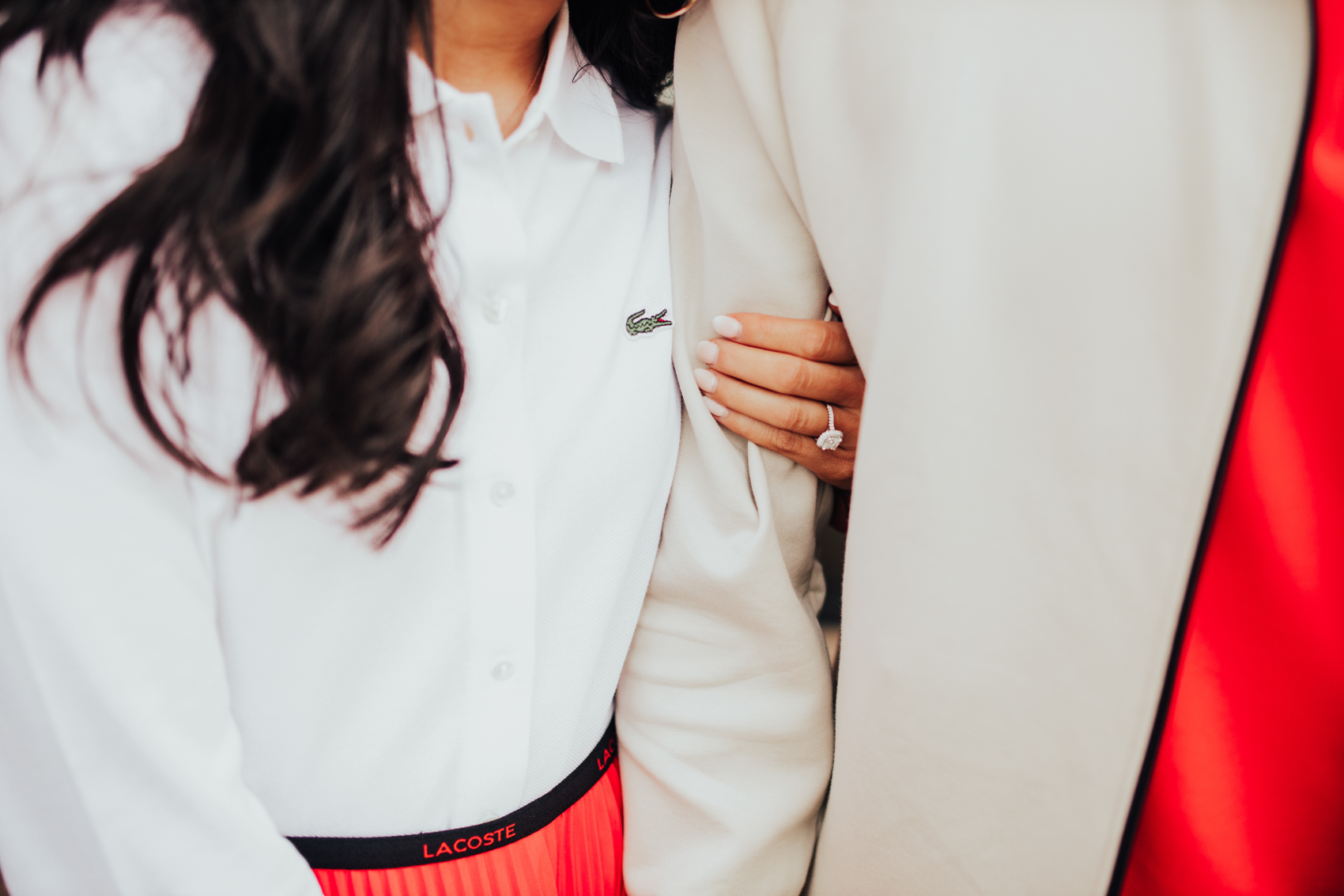 Lacoste soft cotton oxford shirt, branded elasticized pleated skirt, beige zip hoodie, orange polo, James Allen diamond engagement ring