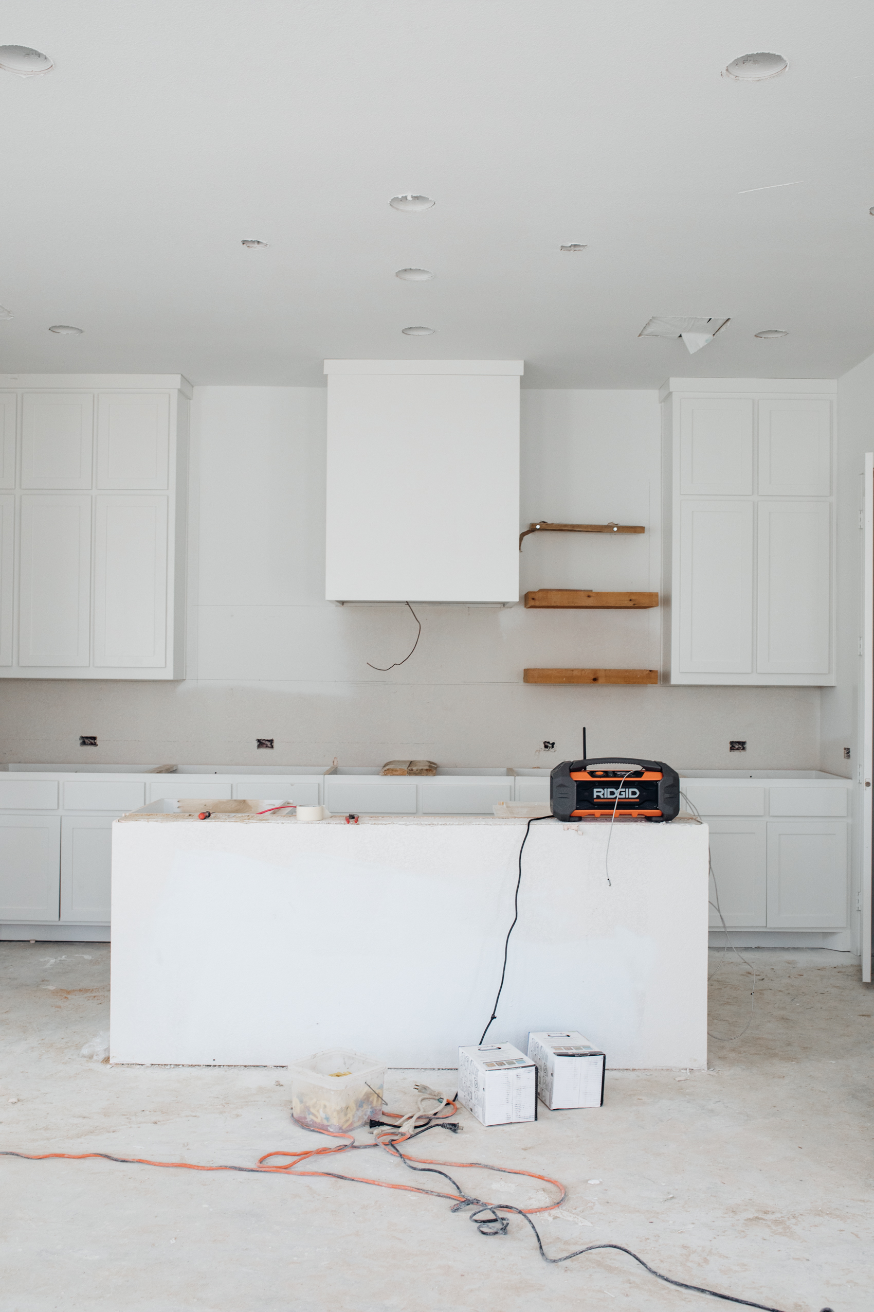 White kitchen with shaker style cabinets in a Dallas home being built