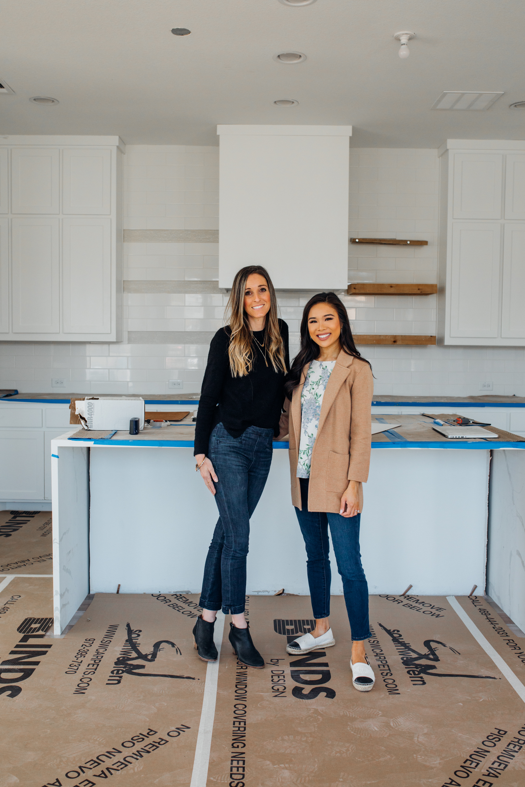 Dallas interior designer Toni Elmer of House Sprucing and blogger Hoang-Kim insider her white kitchen with quartz waterfall island, open shelves, white cabinets, custom range hood in her one-story Dallas new build home