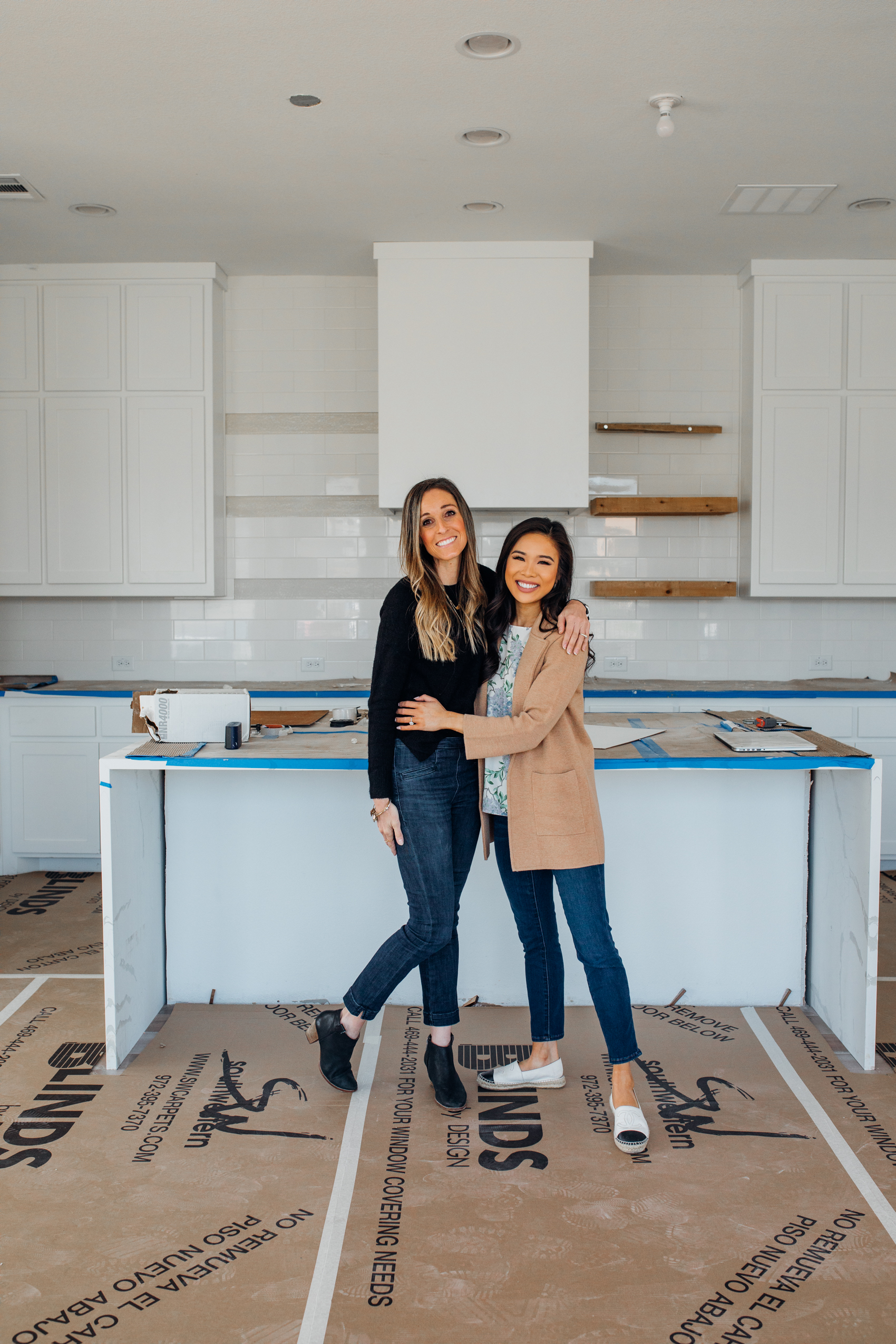 Dallas Interior Designer Toni of House Sprucing and Blogger Hoang-Kim insider her white kitchen with open shelves, waterfall island and white cabinets