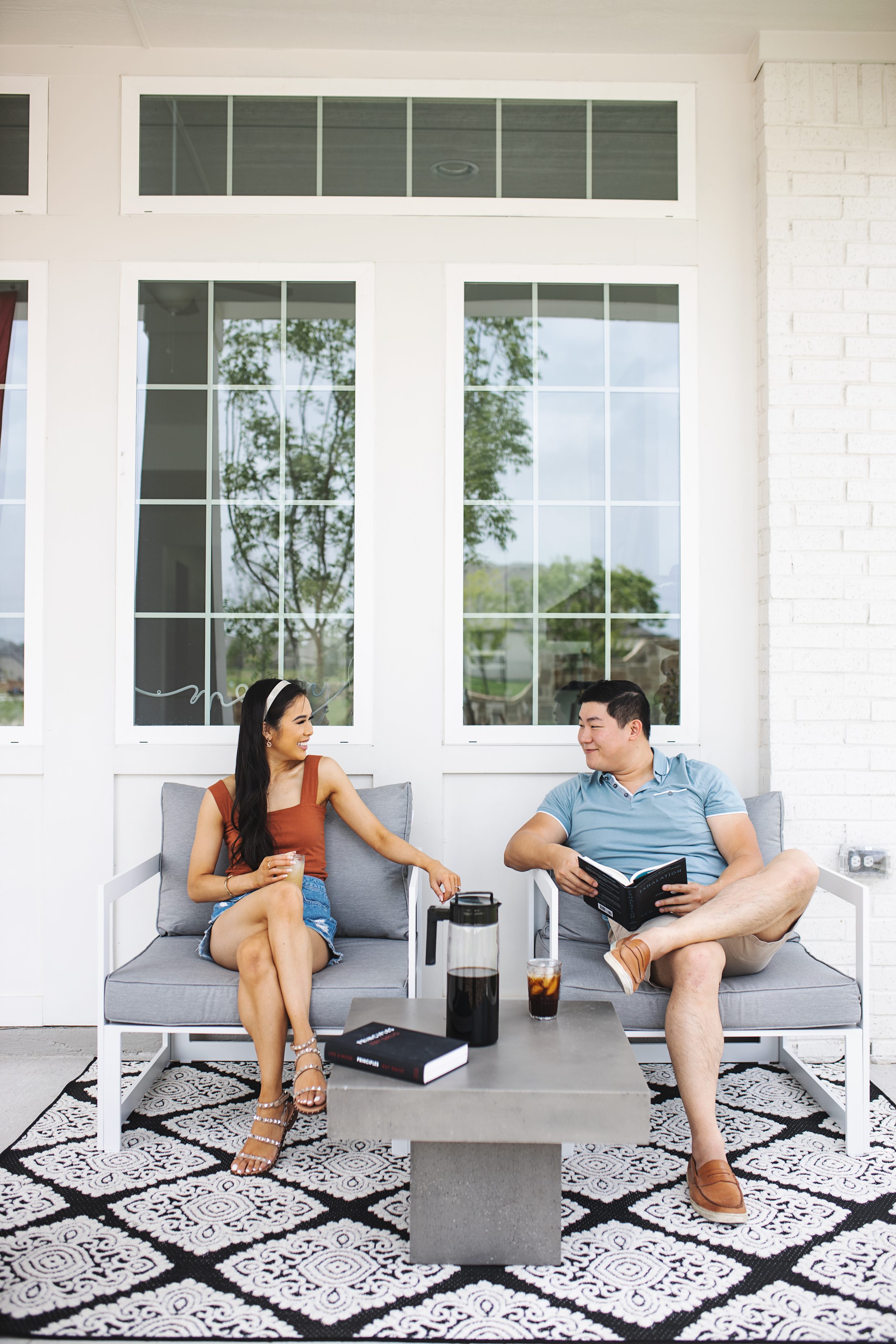 Blogger Hoang-Kim and fiance Jonathan enjoying their modern outdoor furniture