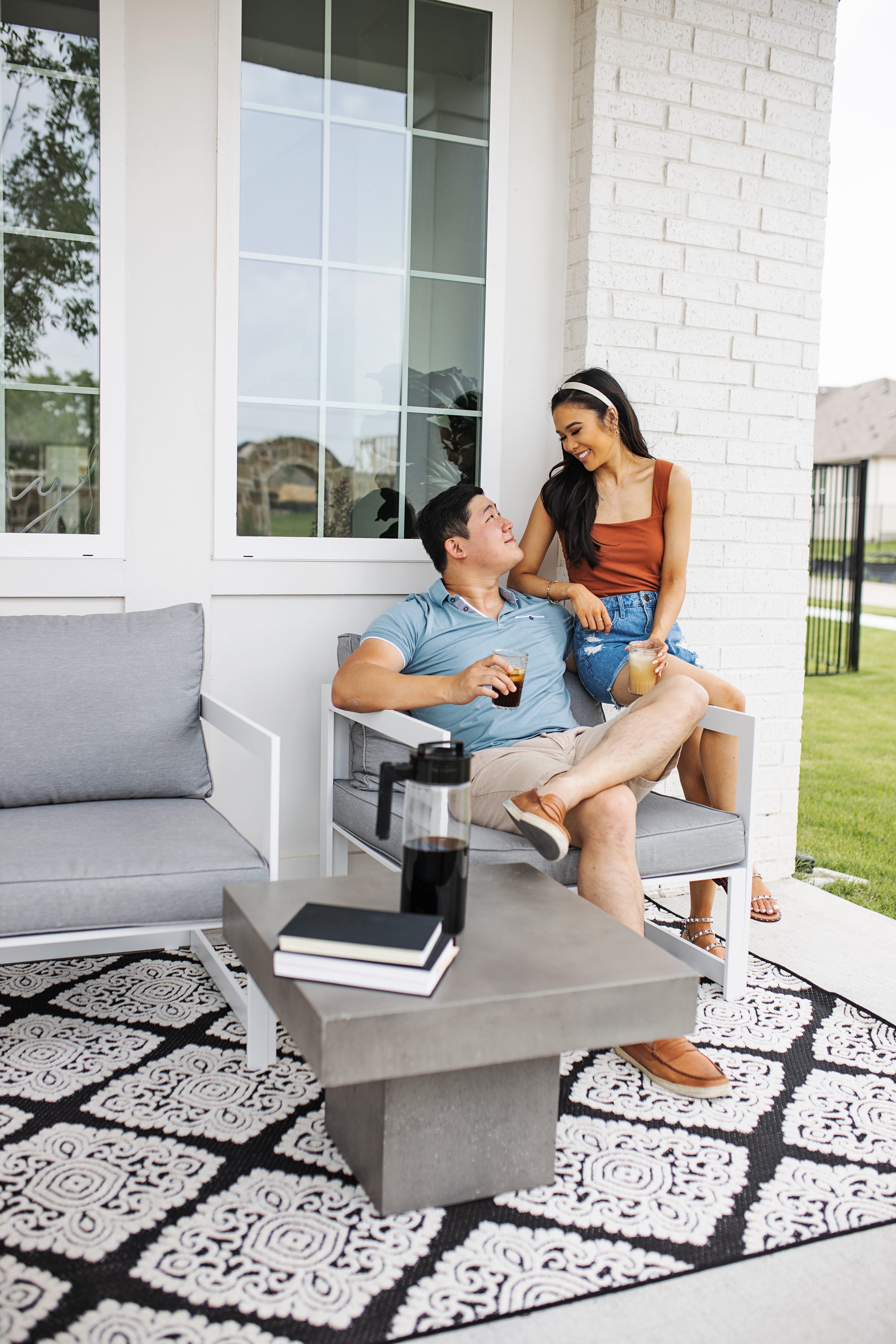 Blogger Hoang-Kim and her fiance Jonathan enjoying their modern outdoor patio furniture