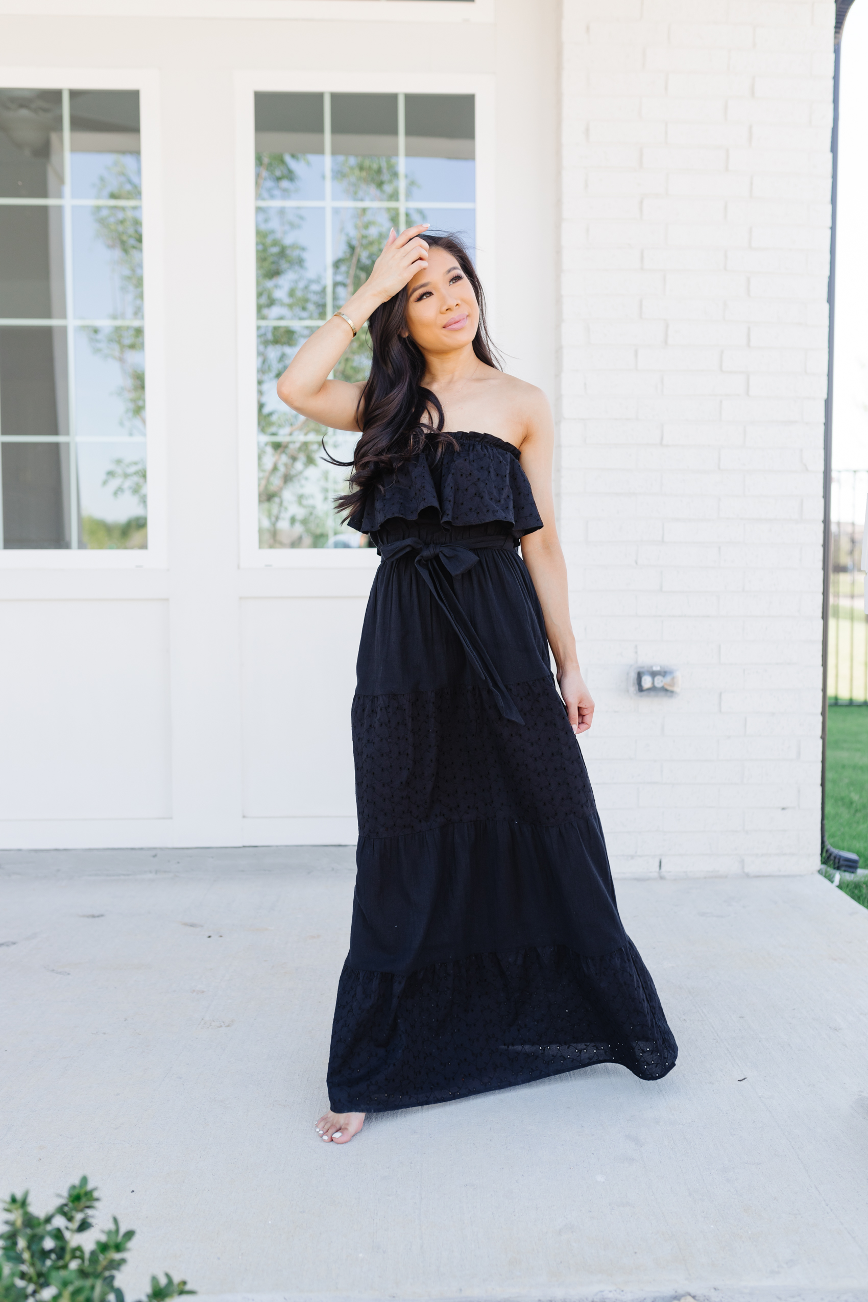 Blogger Hoang-Kim wears a black eyelet maxi dress from Sofia Vegara's Walmart Fashion collection