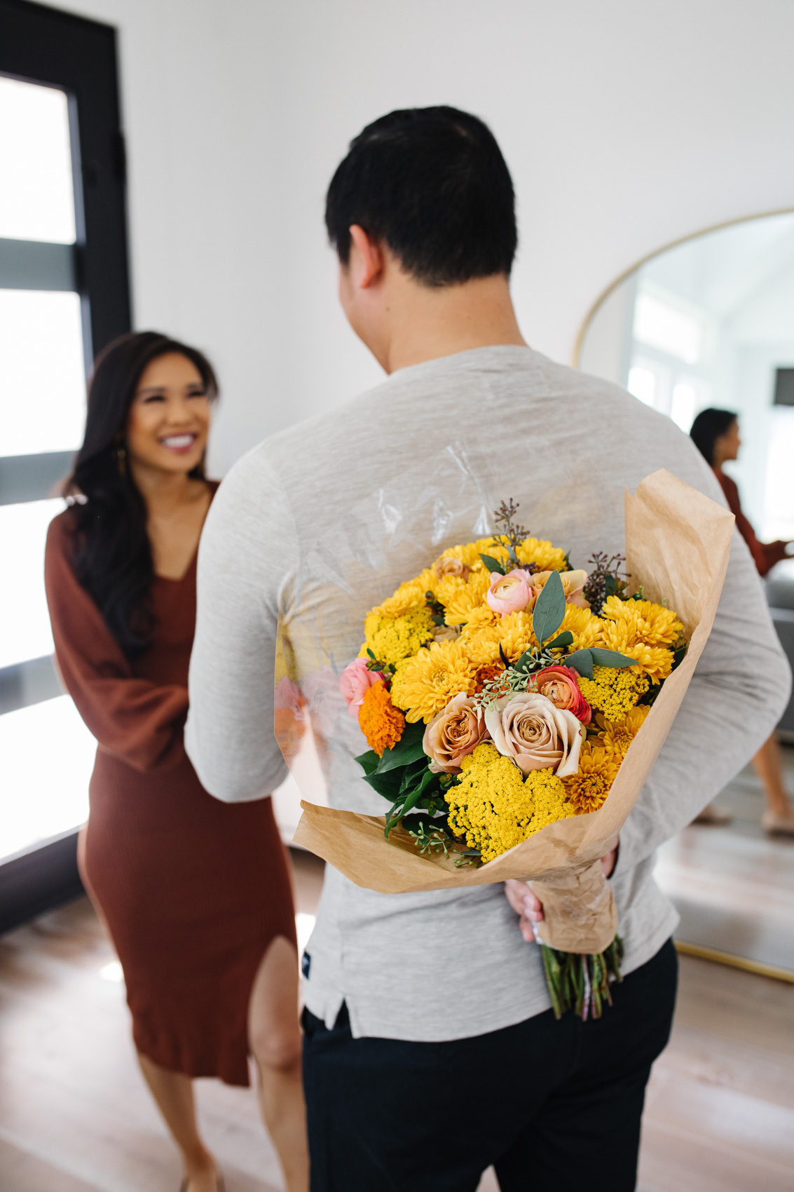 Blogger Hoang-Kim receiving an UrbanStems Ravenna bouquet as a surprise