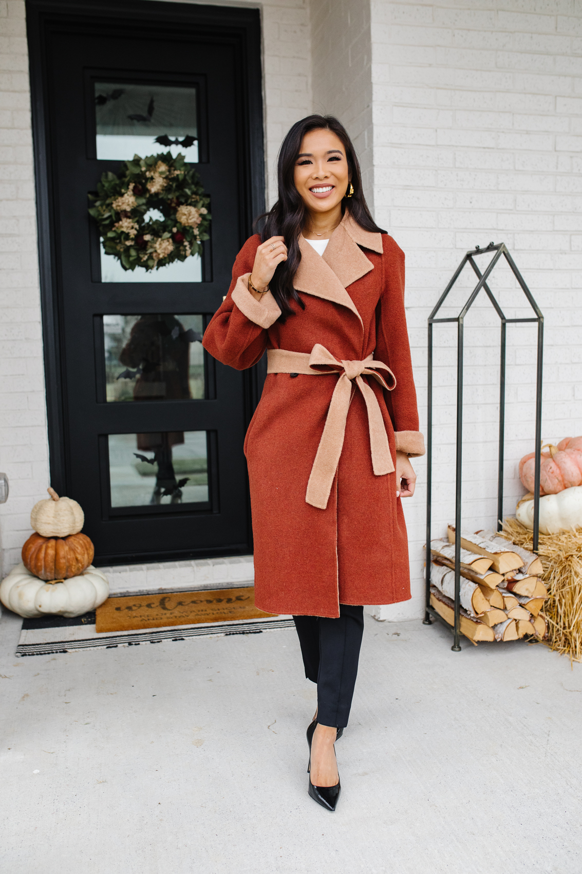 HKCung wearing a reversible wool coat by M.M.LaFleur for fall outfits with black pants and heels