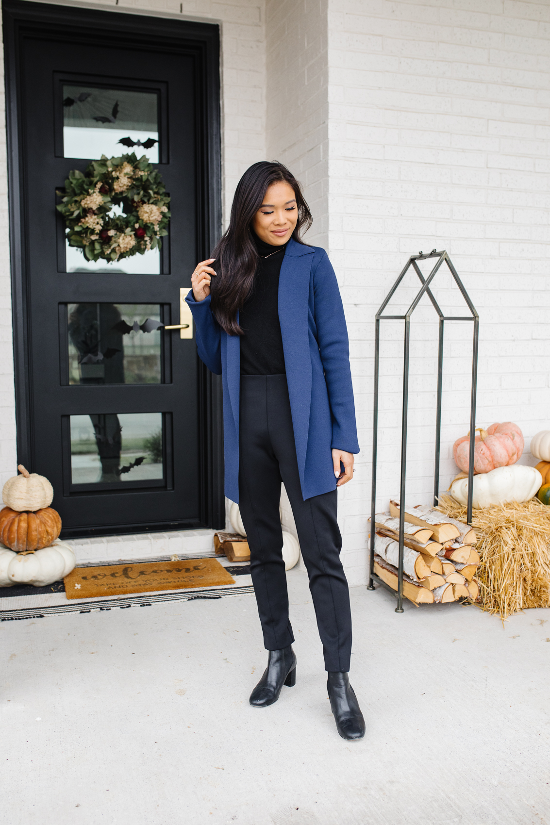 Fall work outfits with M.M.LaFleur's jardigan, black pants, black cashmere sweater and booties