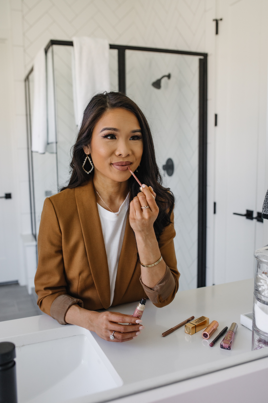 Blogger Hoang-Kim wearing her favorite nude pink lipstick with Too Faced Melted Matte in Cool Girl and Charlotte Tilbury liner in Iconic Nude