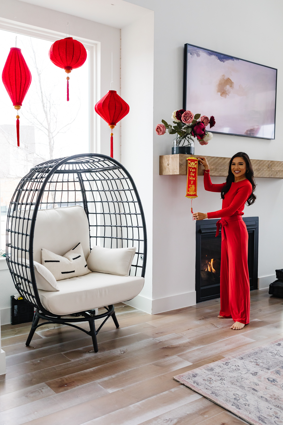 Lunar New Year decorations like red silk lanterns and couplets to decorate for Lunar New Year or Tet Vietnamese New Year in a transitional home