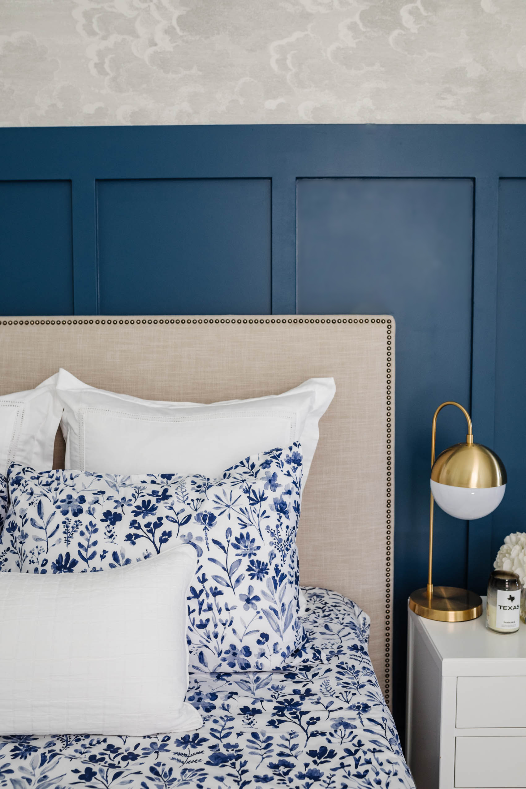 Guest room ideas with boll & branch botanical print sheets, west elm headboard, ppg chinese porcelian board and batten, cole and son nuvolette wallpaper and brass table lamp with white nightstand
