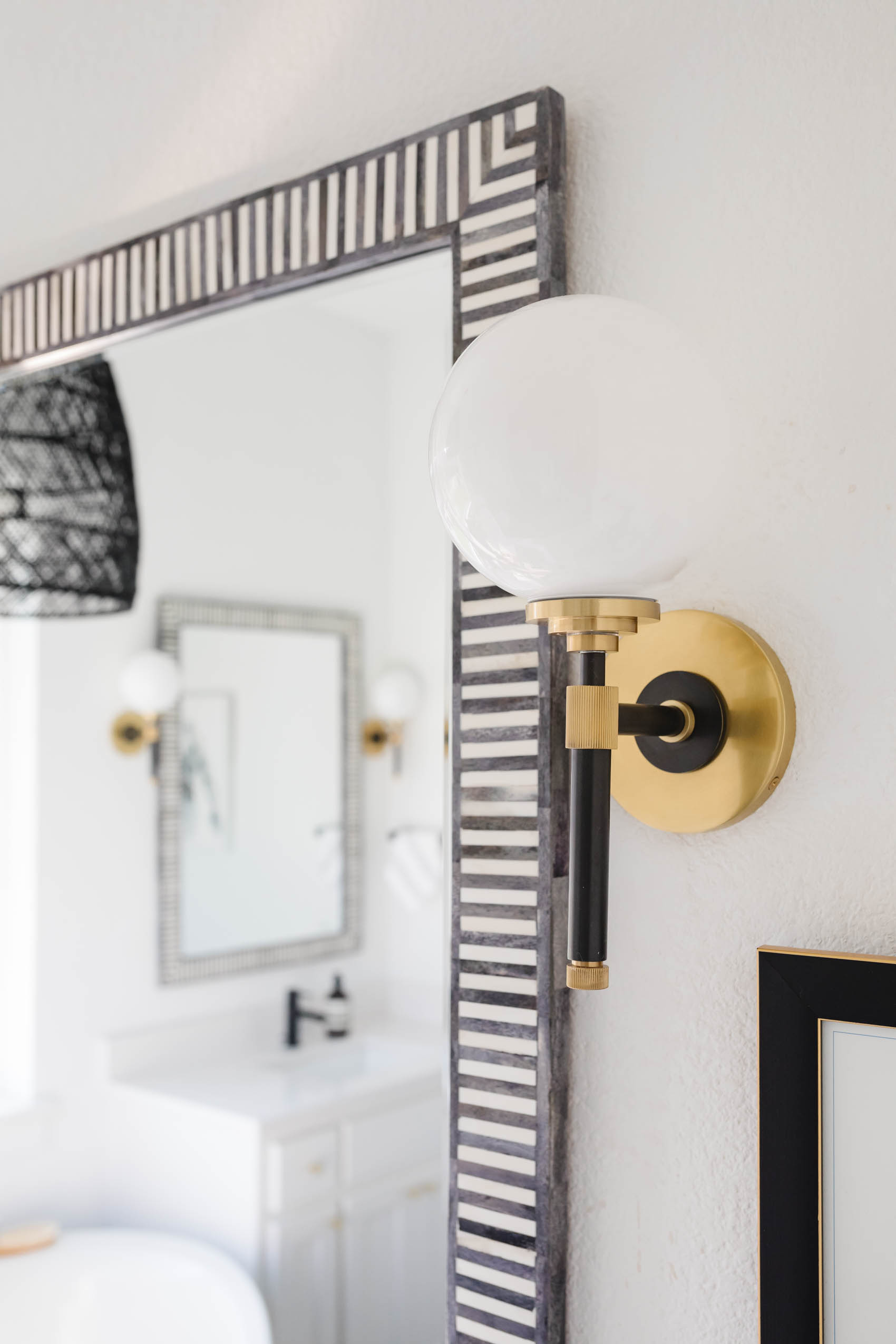 luxury bathroom accessories like Hudson Valley Bowery Sconce and Serena & Lily Bar harbor mirror