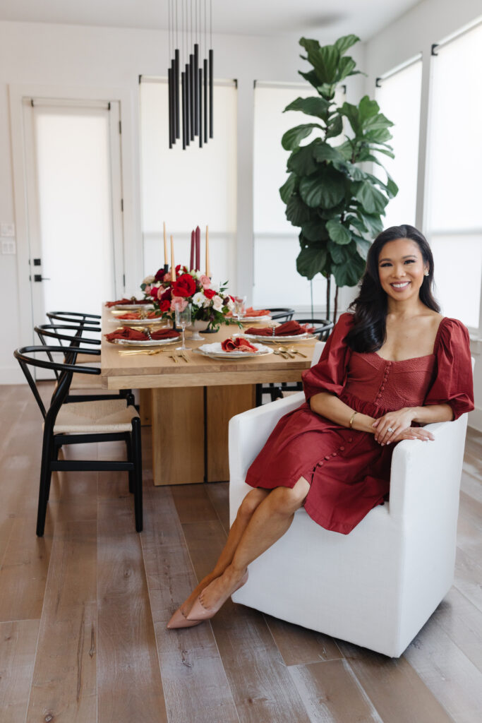 Blogger Hoang-Kim hosts a Thanksgiving dinner for her girlfriends called Galsgiving. Sitting in a Restoration Hardware Ellison chair, McGee and Co extendable dining table, wishbone chairs and a thankstiging table setting.