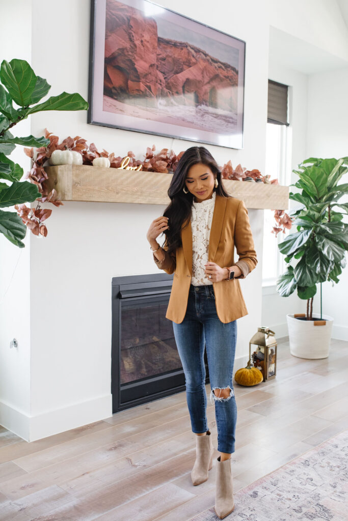 Blogger Hoang-Kim Cung in her transitional style home living room wearing one of her favorite wardrobe staples, the J.Crew Parke Blazer