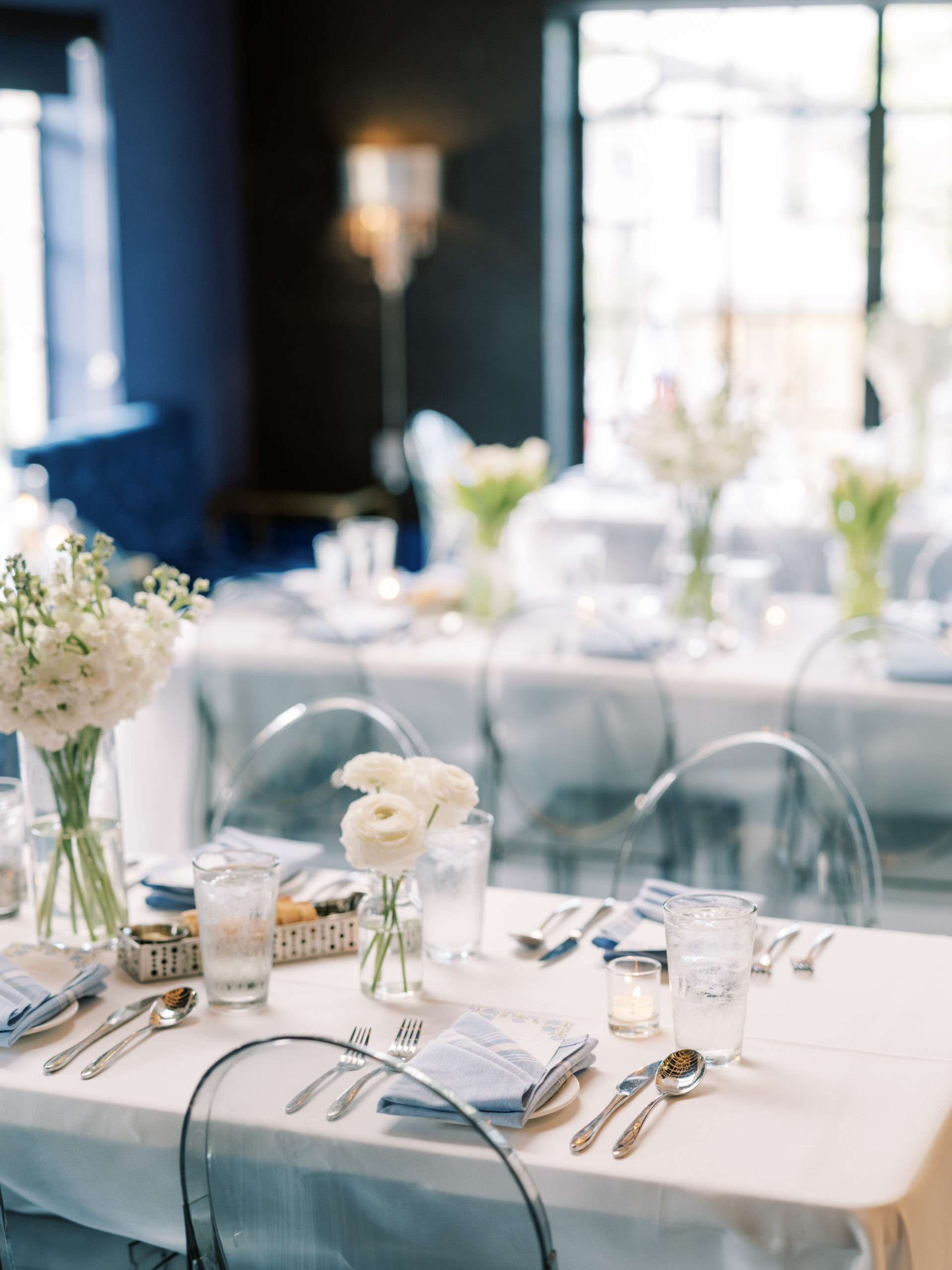 Blue and white rehearsal dinner table setting at Bistro 31 at Highland Park Village in Dallas