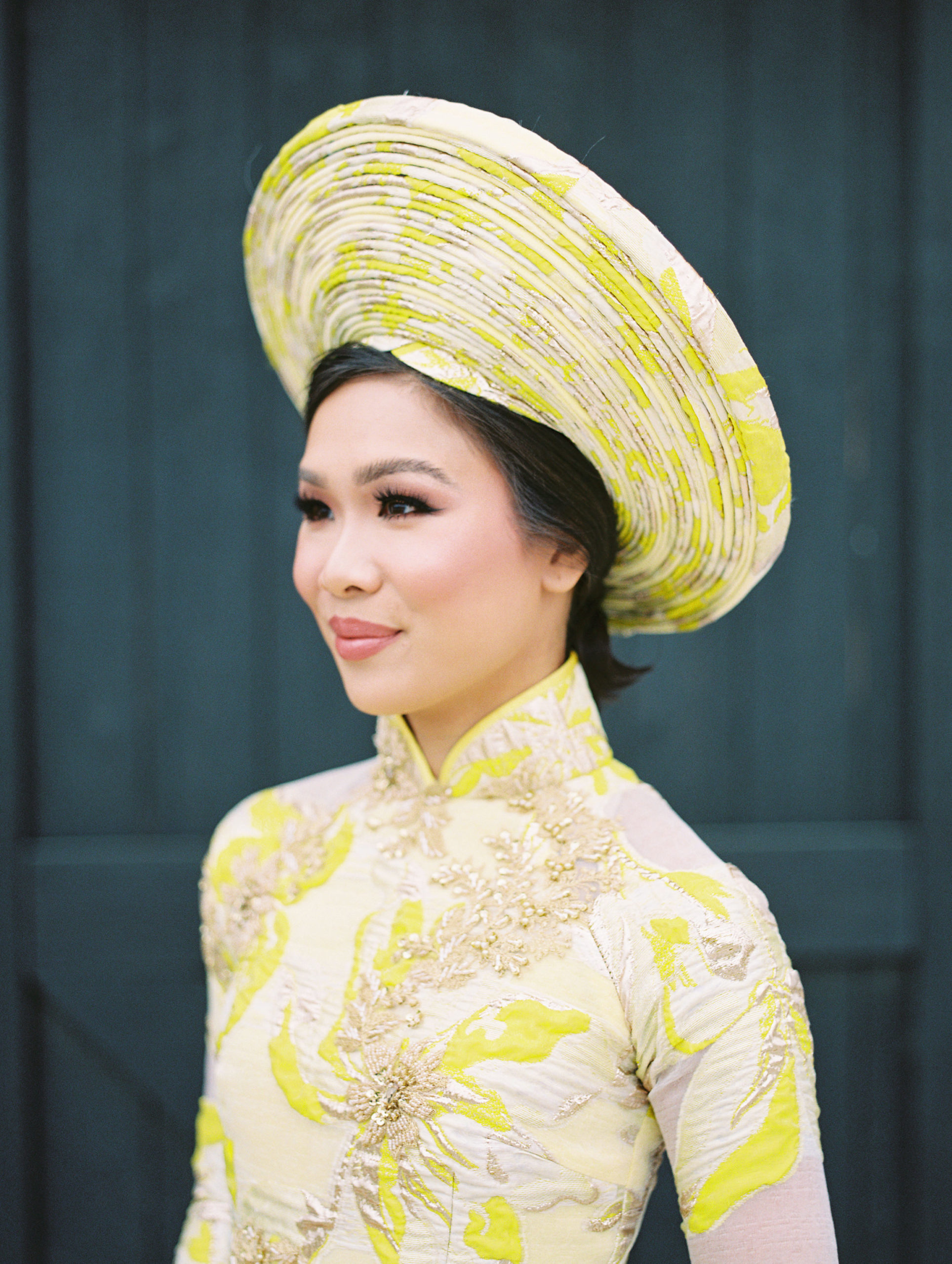 Blogger Hoang-Kim Cung wears a custom ao dai made by Thai Nguyen Atelier for her Vietnamese wedding