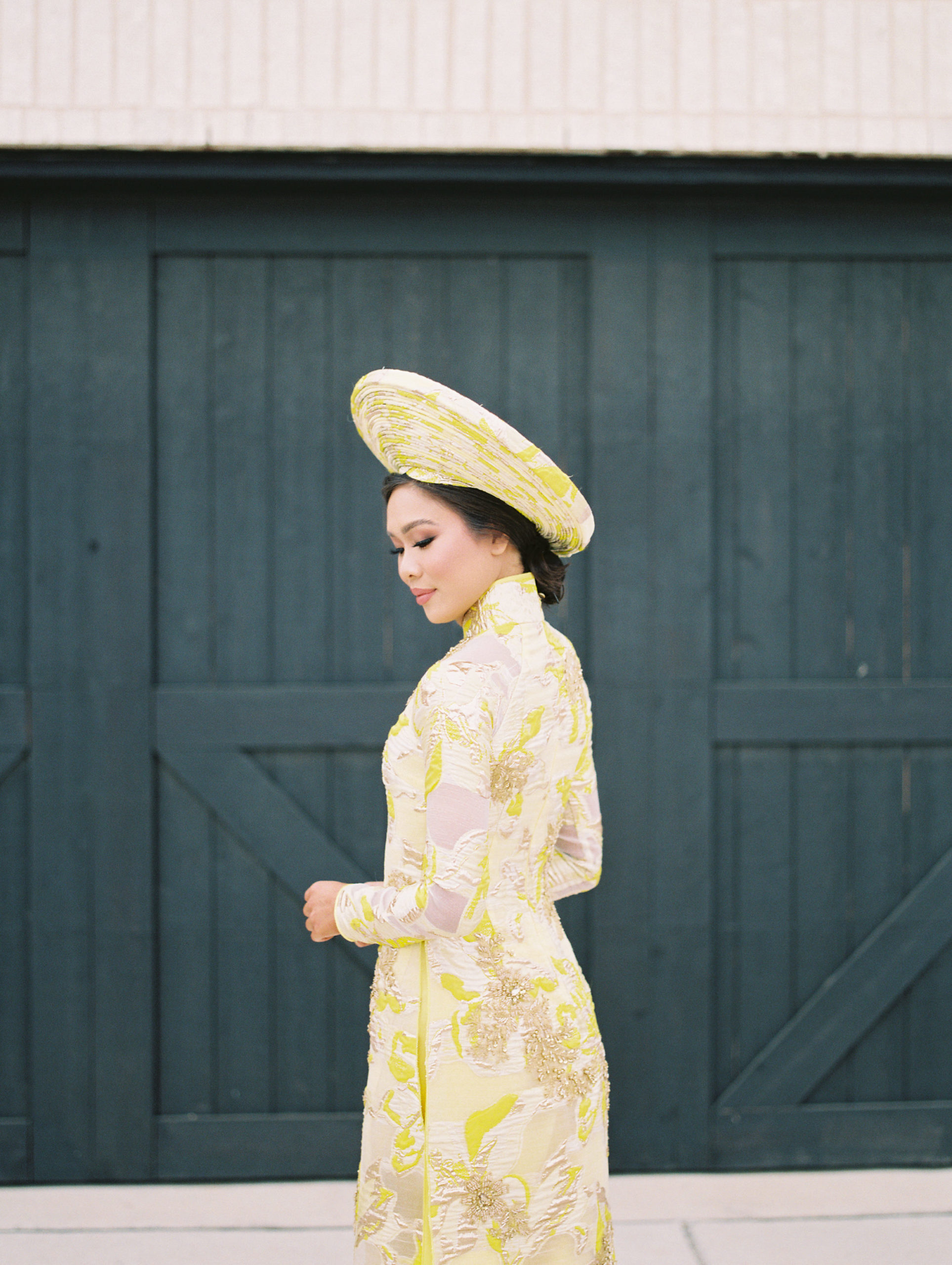 Blogger Hoang-Kim Cung wears a custom ao dai made by Thai Nguyen Atelier for her Vietnamese wedding