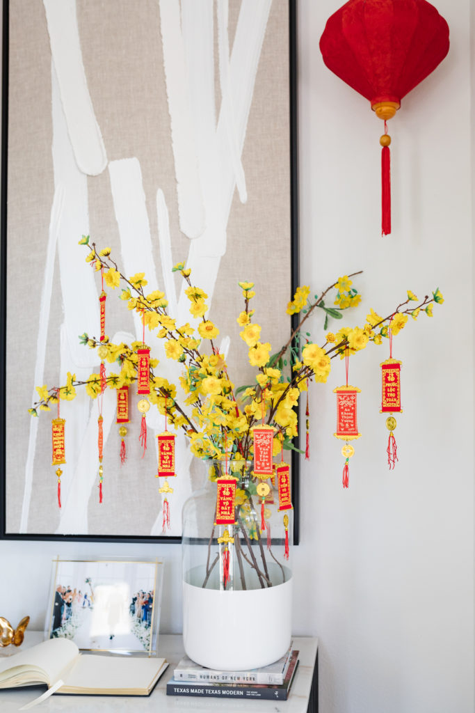 yellow blossoms, small banners and silk lanterns lunar new year decor