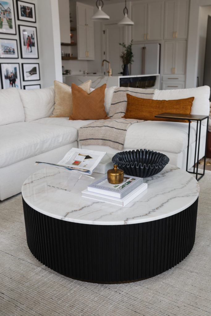 arhaus marble top coffee table in transitional living room
